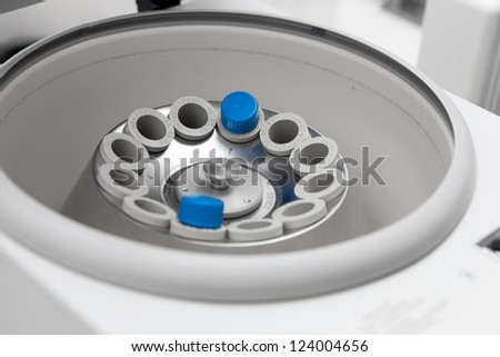 Vortex mixer in bio lab closeup under studio lights