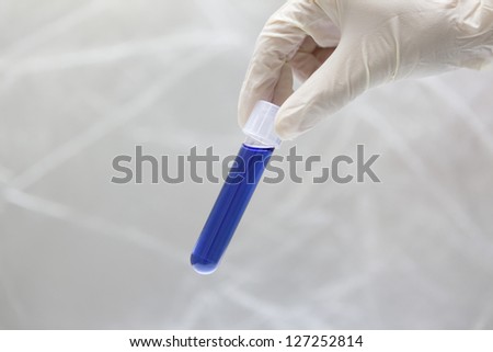 Test-tube in bio lab under studio lights in white background
