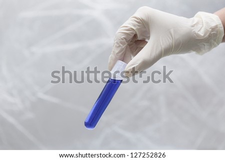 Test-tube in bio lab under studio lights in white background