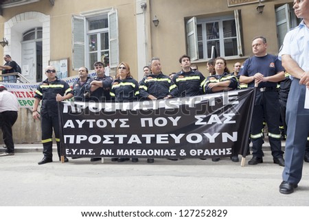 ALEXANDROUPOLIS, GREECE - SEPT 26: Protesters in city streets during protest rally against the greek government\'s new economic measures on September 26, 2012 in Alexandroupolis, Greece.