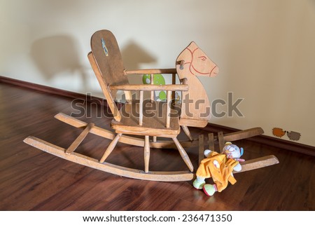 Wooden horse and Soft toy in a child\'s bedroom