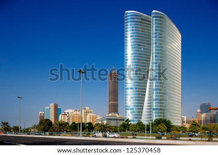 ABU DHABI, UAE - AUGUST 9 - Beautiful curvilinear Architecture of the ADIA Tower, (185 m Abu Dhabi Investment Authority) in abundance on the Corniche Abu Dhabi. Picture taken on August 9, 2012.