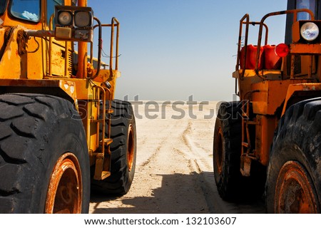 DUBAI, UAE - FEB 20: The heavy plant has arrived in the desert to commence the construction work on Feb 20, 2010 in Dubai, UAE. The World Islands in Dubai is synonymous with the economic crash of 2009