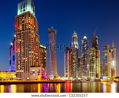DUBAI MARINA, UAE - OCT 2: A night view of Jumeirah Beach Residence Towers on Oct 2, 2012 in Dubai, UAE. Dubai Marina is an artificial 3 km canal carved along the Persian Gulf shoreline