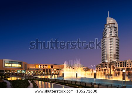 DUBAI, UAE - OCT 10: The Dancing Fountain of Dubai performs to the beat of the selected music at dusk on Oct 10, 2010 in Dubai, UAE. The fountain is overlooked by Dubai Mall and the Address Hotels