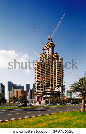 DOHA, QATAR - MAY 2: Development of new skyscrapers on May 2, 2013 in Doha, Qatar. Doha, the capital of Qatar, is rapidly expanding it\'s infrastructure as it gears up for the 2022 FIFA World Cup