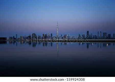 Dubai skyline at dusk seen from the Gulf Coast, shows the Sky Scrapers of the Sheikh Zayed Road