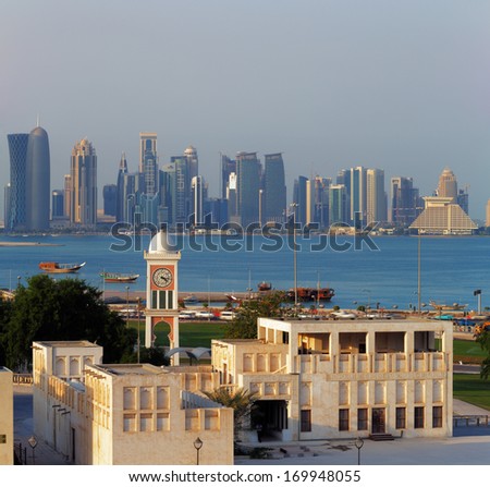 DOHA, QATAR - NOV 13:A contrasting style of architecture can be seen each side of the West Bay on Nov 13, 2013 in Doha, Qatar. The West Bay is considered as one of the most prominent districts of Doha