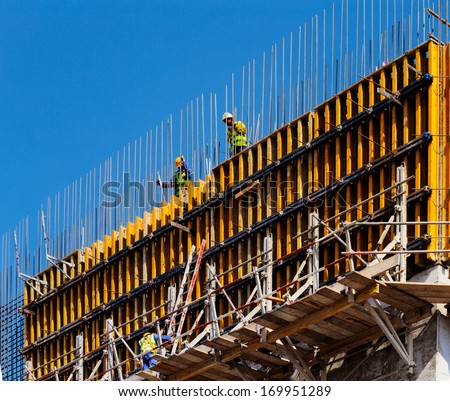 Doha, Qatar - Nov 13: Two Builders Are Preparing The Reinforced Concrete Shuttering On Nov 13, 2013 In Doha, Qatar. Doha, Is Preparing It\'S Infrastructure For The World Cup In 2022