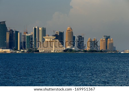 DOHA, QATAR - NOV 14: Iconic new towers grace the skyline of the West Bay area of Doha on Nov 14, 2013 in Doha, Qatar. The West Bay is considered as one of the most prominent districts of Doha