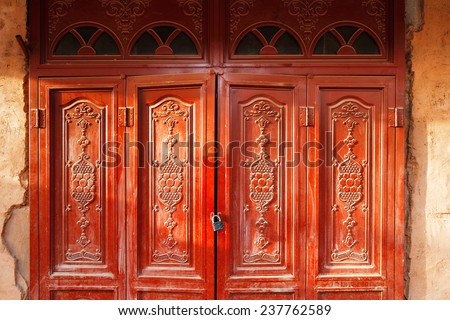 KASHGAR, CHINA - JUL 11: Ornate doors are very common in the ancient city of Kashgar on Jul 11, 2014 in Kashgar, China. Kashgar is an oasis Chinese city on the silk trading route