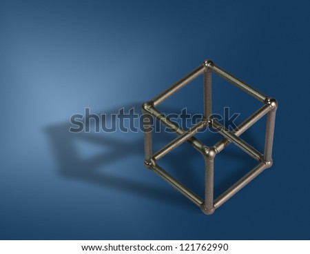 Welded cube on blue background. Optical illusion