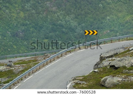 Sharp curve sign on a dangerous highway