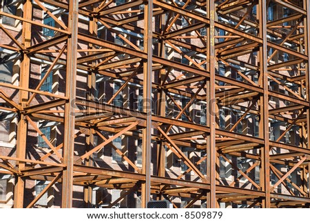 Dense iron scaffolding with rusty colors in an abstract pattern