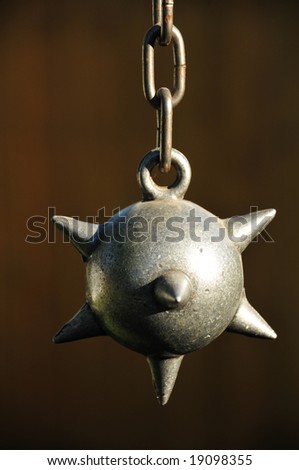 ball and chain on dark brown background