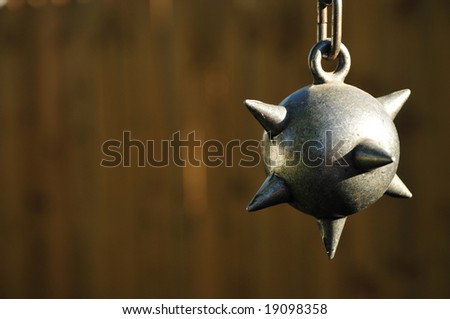 ball and chain on light brown background