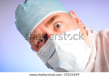 Doctor or medical worker in a hat and mask head tilted shock