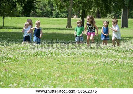 sunny day in the park with children playing