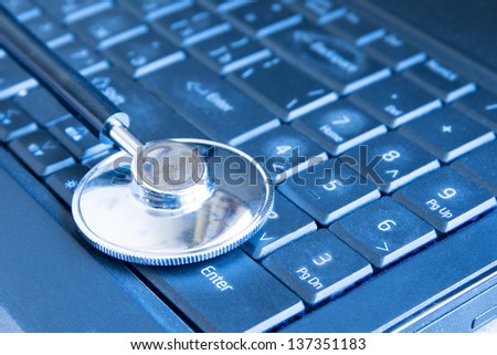 Stethoscope on keyboard (computer, laptop) close up. Medical education and information concept.