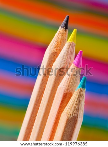 Cyan, magenta, yellow and black on colored background