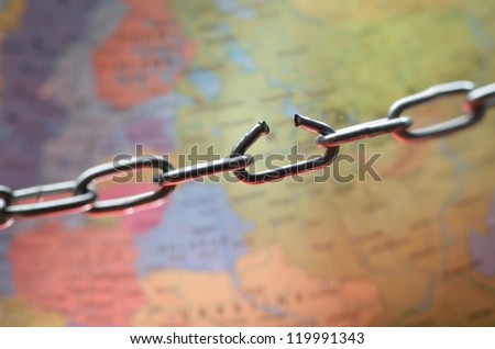 Broken chain link above the world map