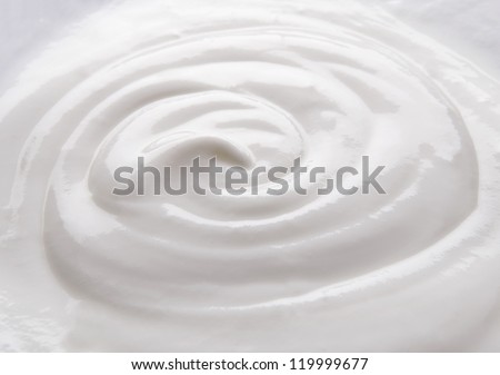 Creamy natural yogurt background. Closeup view.