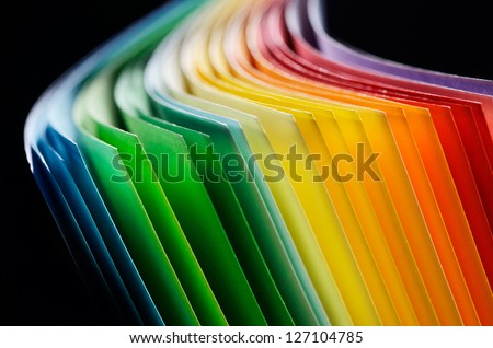 Colorful paper section in elliptical shapes on black background