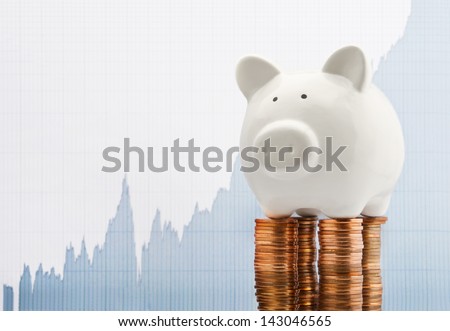 Saving growth line graph with piggy bank