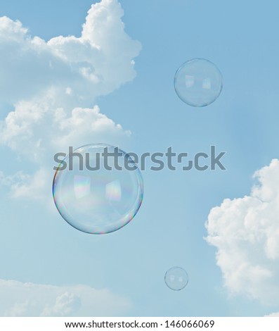 Day dreaming. Two floating soap bubbles against blue sky with copy space