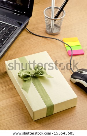 Office surprise. Office scene with present, keyboard and office supplies