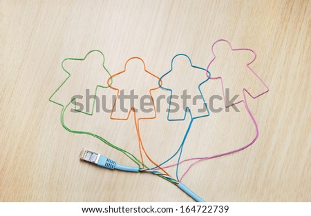 Social networking. Ethernet cable shaping silhouettes of virtual users