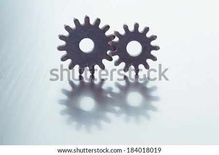 Metal gears. Close-up of two steel gears linked concept for love, family, teamwork and partnership