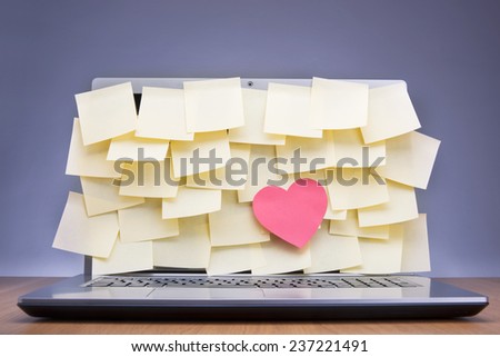 Colored post-it notes covering laptop screen