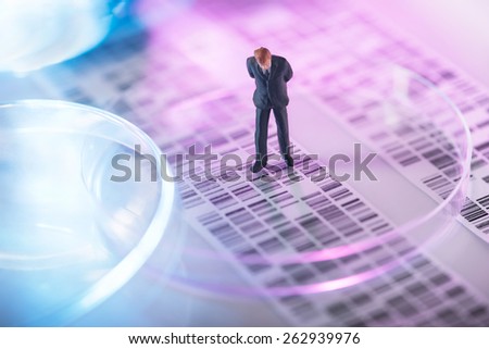 Man looking at DNA gel into petri dish