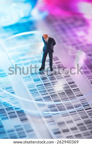 Man looking at DNA gel into petri dish