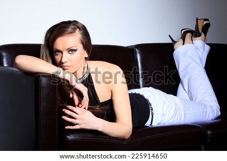 Model lying on a sofa