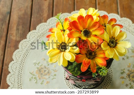 beautiful flower in pot decoration on table at coffee shop