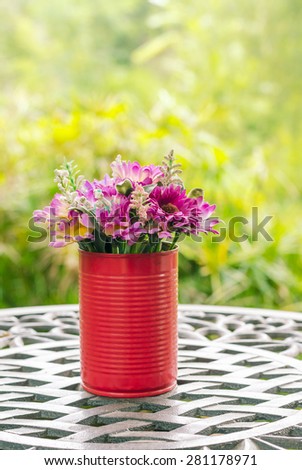 beautiful flower in canned D.I.Y (Do it yourself) the decoration on table in vintage style