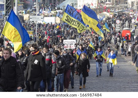 KIEV, UKRAINE -DEC. 3, 2013: Students procession of to the Supreme Rada with slogans of protest against of violence