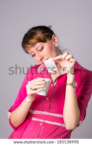 girl with a glass of hot water makes tea