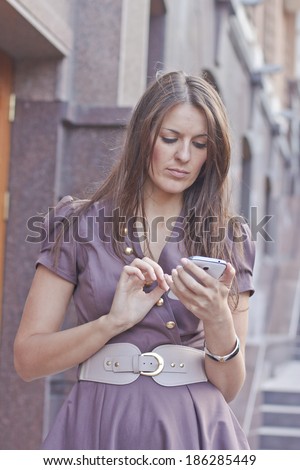 Business woman using app on a smartphone