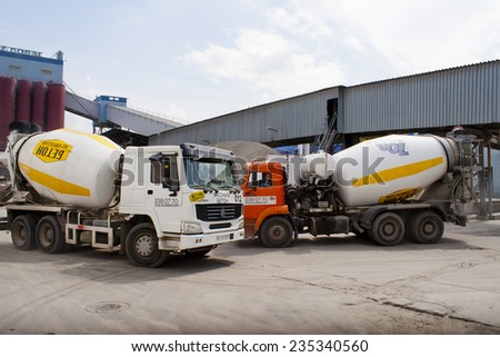 KIEV, UKRAINE - May 17 2013: The territory of the of the concrete plant. Concrete mixers tucked with concrete