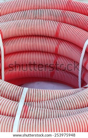 Red plastic tubes in the warehouse