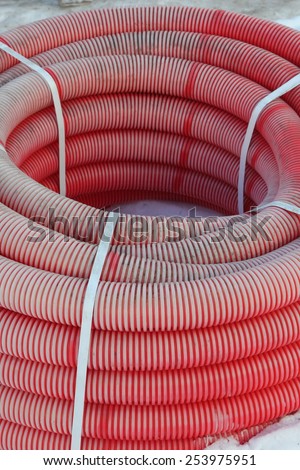Red plastic tubes in the warehouse