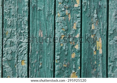 Old wooden painted green rustic background, paint peeling