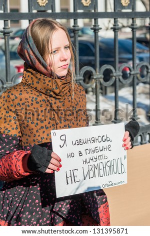 MOSCOW - MARCH 8: Russian activist holds placard quotes Russian poet Osip Mandelstam 