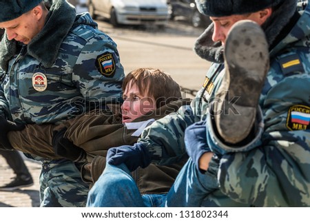 MOSCOW, RUSSIA - 8 MARCH: Police arrests one of the activists on picket to free Pussy Riot members on March 8, 2013 in Moscow.