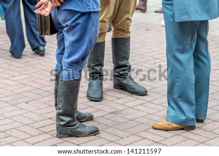 MOSCOW, RUSSIA -  MAY 26: Retro festival \'Days of history\' in Hermitage Garden. Three man standing in retro style shoes and boots. Moscow, May 26, 2013