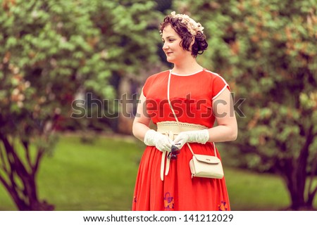 MOSCOW, RUSSIA -  MAY 26: Retro festival \'Days of history\' in Hermitage Garden. Woman wearing soviet retro style clothes. Moscow, May 26, 2013