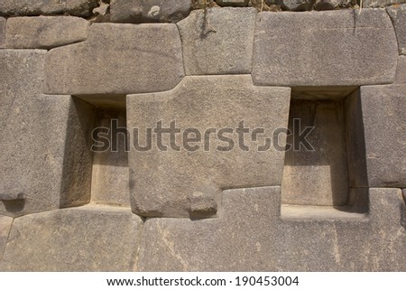 Each carving is simetric to the other in the temple of the sun of the old Inca town of Ollantaytambo, Sacred Valley, Peru